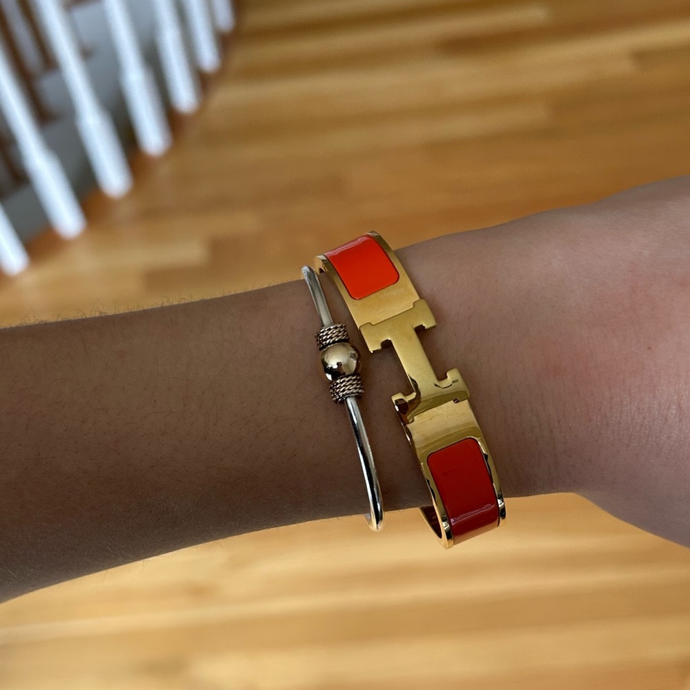 H gold and orange bracelet.